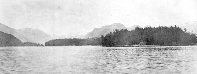 Village Island in the distance across an expanse of water.