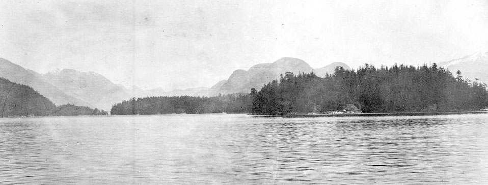 Village Island in the distance across an expanse of water.