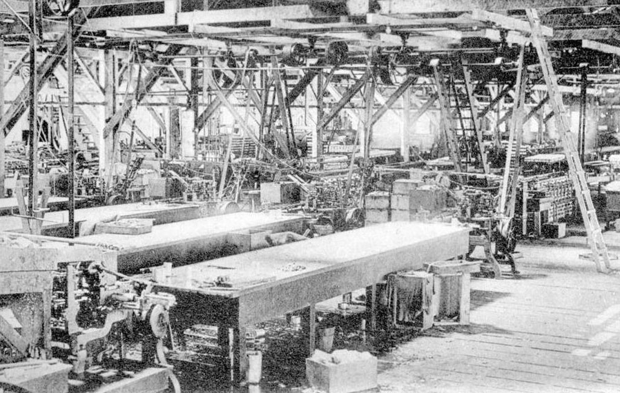 Interior of a salmon cannery, with mechanized canning line.