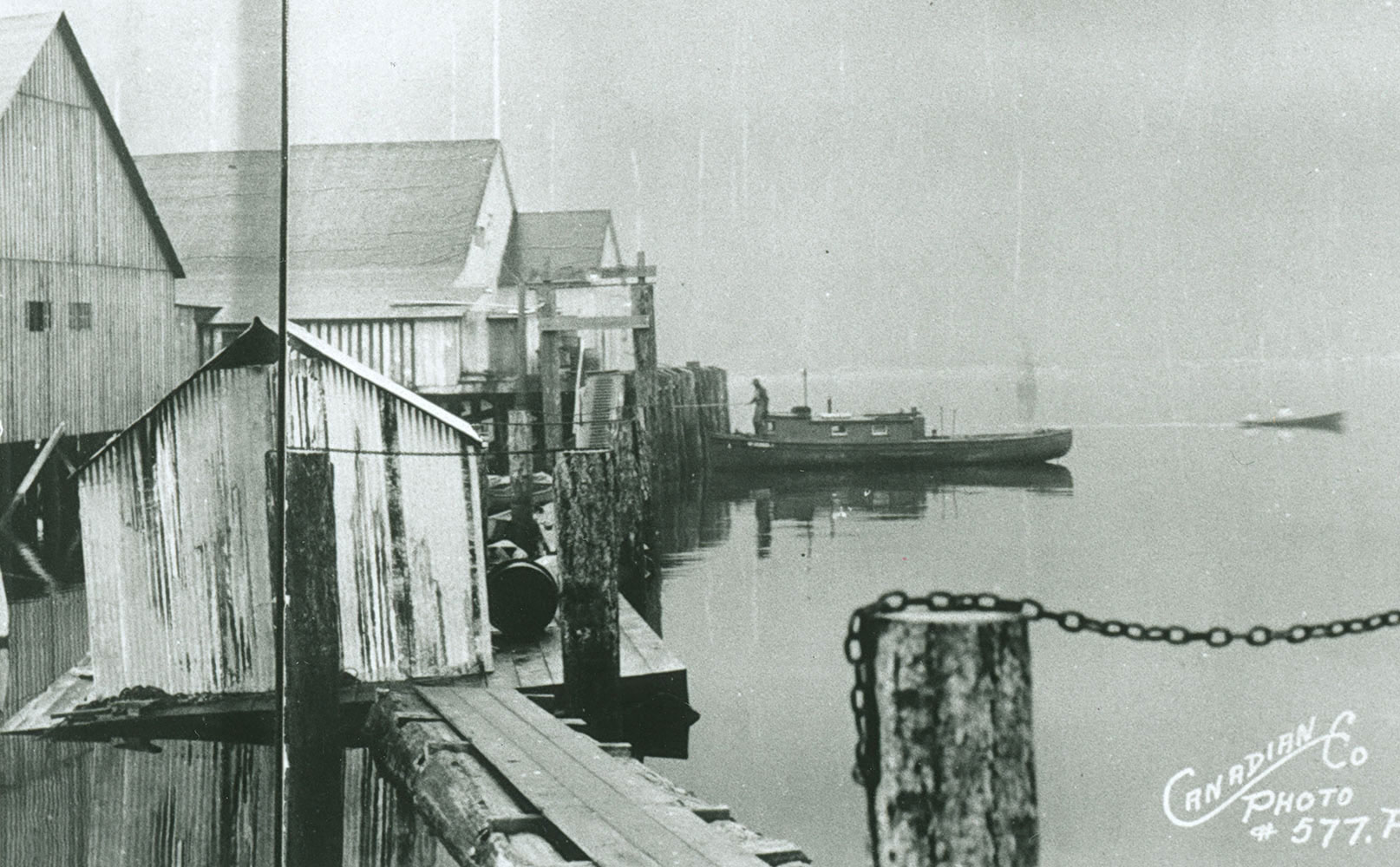 The main cannery building is supported by floats and pilings. The words "Canadian Co. Photo #577.P." are inscribed on the photo.